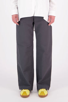 The N-E-S Gin Pants are a best-selling essential, designed to flatter all body shapes with a clean, classic cut. Featuring a flat front, elasticated back, and angled side pockets, they blend comfort and polish effortlessly. Made from a cotton blend, cool-to-the-touch, they're perfect for work, travel, or everyday wear. Whether dressed up or down, the Gin Pants are your go-to for timeless style and all-day ease.

Our model is 174cm and wear a XS (8)

Composition: cotton nylon
Designed and Made in New Zealand