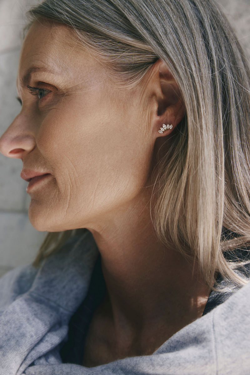 Grace Earrings by Castel & Co are gold-plated stainless steel stud earrings featuring a delicate zircon detail for a subtle, refined shine. Designed to catch the light without overpowering the look, making them ideal for everyday wear or layering. Measuring 0.5 x 1.2 cm with a secure stud closure. Waterproof and hypoallergenic.