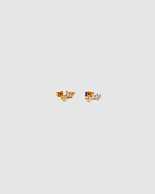 Grace Earrings by Castel & Co are gold-plated stainless steel stud earrings featuring a delicate zircon detail for a subtle, refined shine. Designed to catch the light without overpowering the look, making them ideal for everyday wear or layering. Measuring 0.5 x 1.2 cm with a secure stud closure. Waterproof and hypoallergenic.