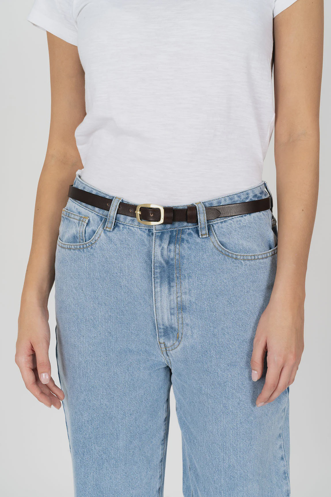 HUMIDITY LIFESTYLE -  TWIGGY BELT AVAILABLE IN BLACK & COCOA.
A timeless belt crafted with 100% smooth leather, double leather keeper and rounded brass buckle.
100% leather.
Smooth leather strap.
Brass buckle.
Designed to be worn at waist.
Adjustable - 7 holes.
Responsibly sourced leather. 
