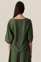 Made from our bestselling cupro blend, the POL Henri Tee has a vintage inspired silhouette in a modern fabrication.

-Wide round neckline with topstitch detailing - flat at the front with gathering over the shoulders and back.
-Pull on style.
-Full sleeves designed to sit just below the elbow.
-Relaxed fit through the body - designed to be worn unfitted.