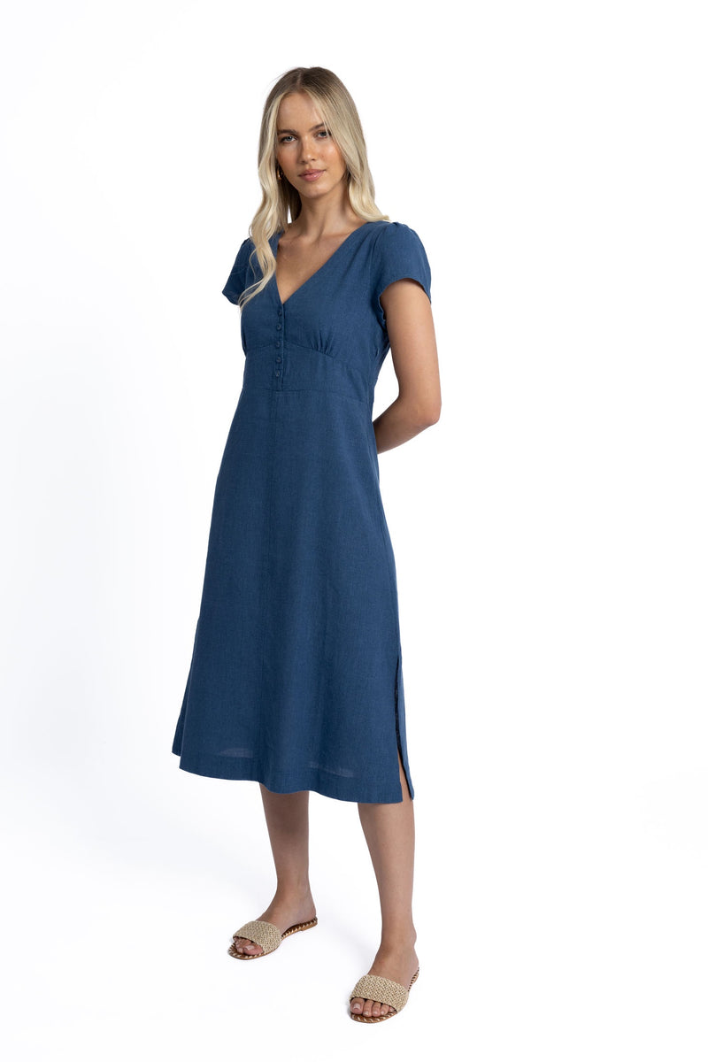 HUMIDITY LIFESTYLE – JORJA DRESS
• &nbsp; &nbsp;Our most flattering summer dress is back!
• &nbsp; &nbsp;Classic A-line shape with invisible side zip.
• &nbsp; &nbsp;Flattering V neckline with self-covered buttons.
• &nbsp; &nbsp;Gathers at bust and shoulders.
• &nbsp; &nbsp;Darts at back enhance the flattering shape.
• &nbsp; &nbsp;Side splits.
• &nbsp; &nbsp;True to size, fitted at bust and waist - check your measurements below for fitting guide.