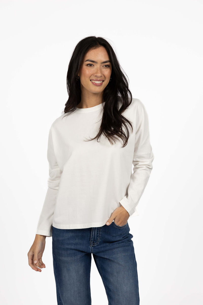 HUMIDITY LIFESTYLE 
Not your average long sleeve. Meet the Wildfire Long Sleeve Tee – your new go-to for cosy, casual dressing. Crafted from our signature ultra-soft cotton, this long sleeve tee is designed for comfort with a fashionable twist. The relaxed, oversized fit and dropped shoulder create an effortlessly cool silhouette that works just as well on the couch as it does out and about.