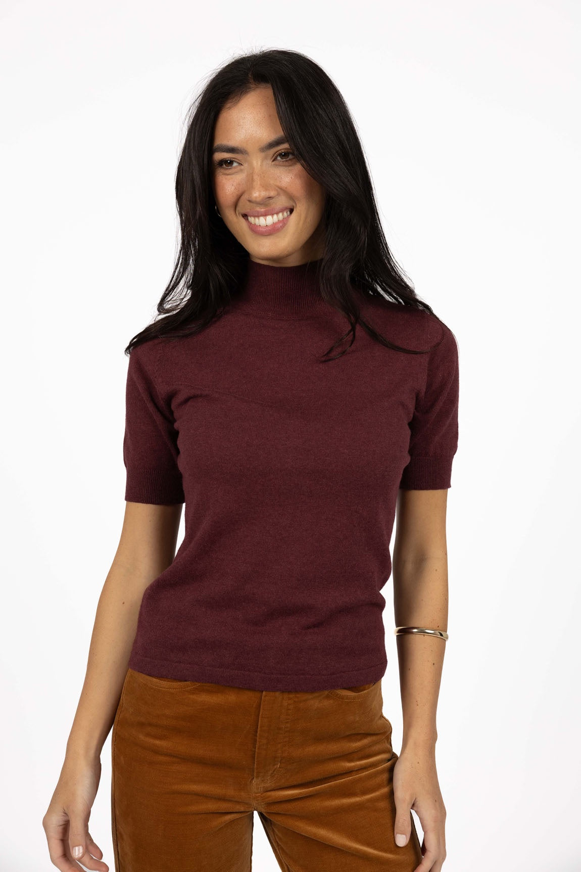 Vera knit top available in black, claret, and hazelnut, crafted from a soft, lightweight cotton/cashmere blend. Designed with a high neckline, sleeves finishing just above the elbow, and ribbed detailing on the neck, cuffs, and hem. The length sits just below the hips, making it ideal for easy tucking and layering. A cosy, non-itch knit perfect for cooler weather, offering a comfortable, true-to-size fit for both work and weekend wear.