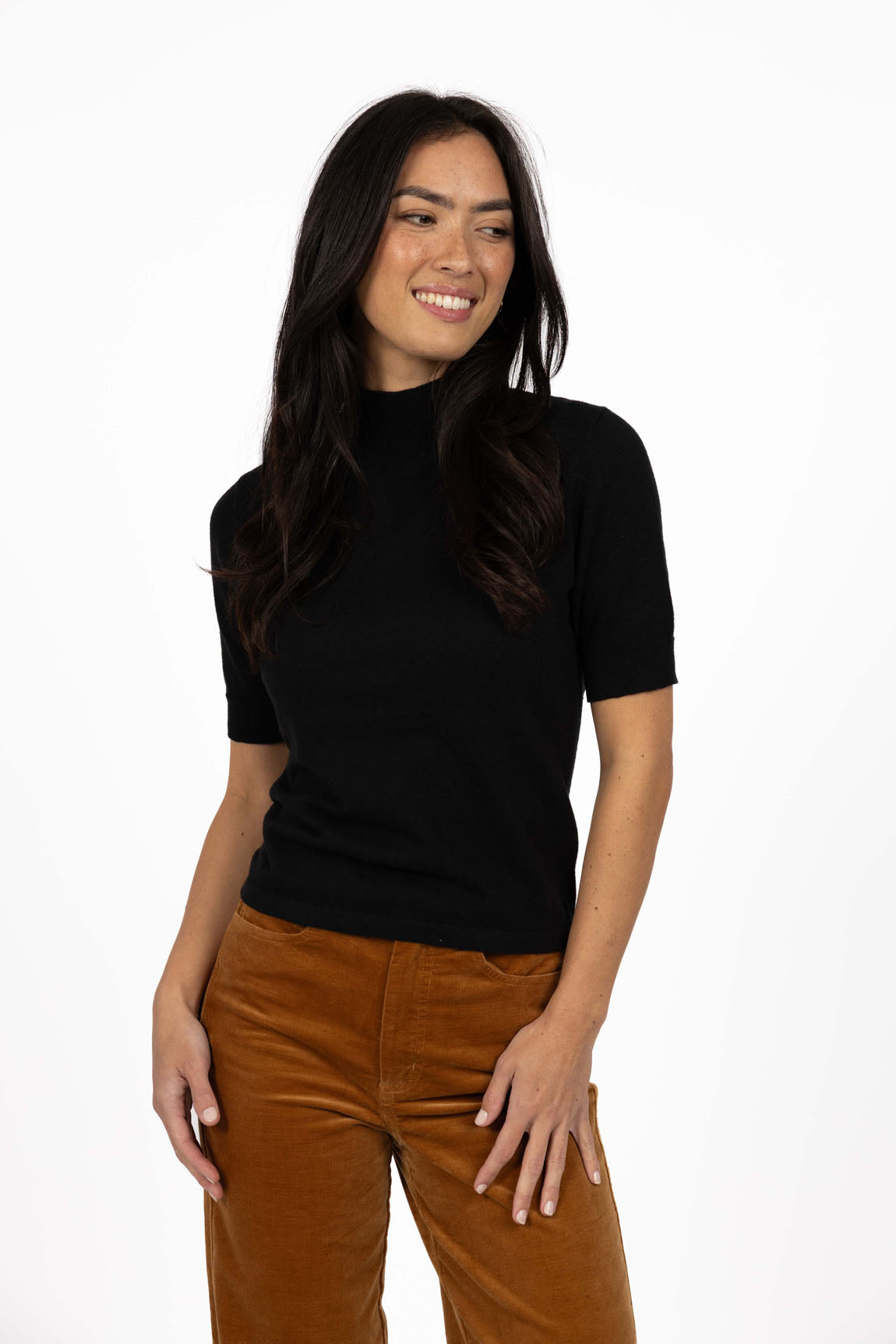 Vera knit top available in black, claret, and hazelnut, crafted from a soft, lightweight cotton/cashmere blend. Designed with a high neckline, sleeves finishing just above the elbow, and ribbed detailing on the neck, cuffs, and hem. The length sits just below the hips, making it ideal for easy tucking and layering. A cosy, non-itch knit perfect for cooler weather, offering a comfortable, true-to-size fit for both work and weekend wear.