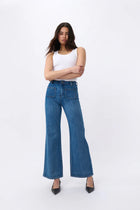 Kireina's again returned to their inspiration – the bold, adventurous '70s - and paid extra attention to the details. The Harper Jean is their new classic wide-leg jean. Featuring front patch pockets and a high-rise, it hugs the figure with a slim hip and flares out gently for a truly flattering look. They’re made from their signature stretch denim so they’re the women’s jean that is as comfortable as it is stylish.

FEATURES:
- High Rise Wide Leg
- Average Inside Leg Length = 82cm
- Patch pockets front and
