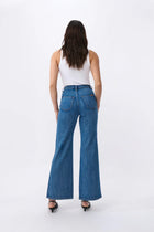 Kireina's again returned to their inspiration – the bold, adventurous '70s - and paid extra attention to the details. The Harper Jean is their new classic wide-leg jean. Featuring front patch pockets and a high-rise, it hugs the figure with a slim hip and flares out gently for a truly flattering look. They’re made from their signature stretch denim so they’re the women’s jean that is as comfortable as it is stylish.

FEATURES:
- High Rise Wide Leg
- Average Inside Leg Length = 82cm
- Patch pockets front and