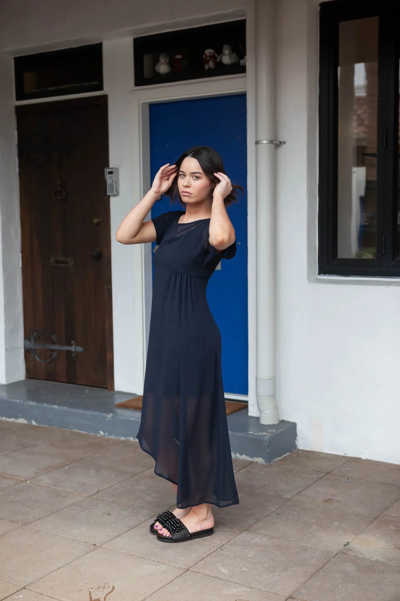 The NES Flow Dress is a multi-seasonal, versatile style that seamlessly transitions from casual to formal occasions. This dress offers a variety of styling options—wear it draped down across the front for a relaxed look, or cinch it up at the side using the adjustable side button and hem loopers for a more structured appearance. The perfect balance of comfort and elegance, this dress can be styled with our Lattice Slip