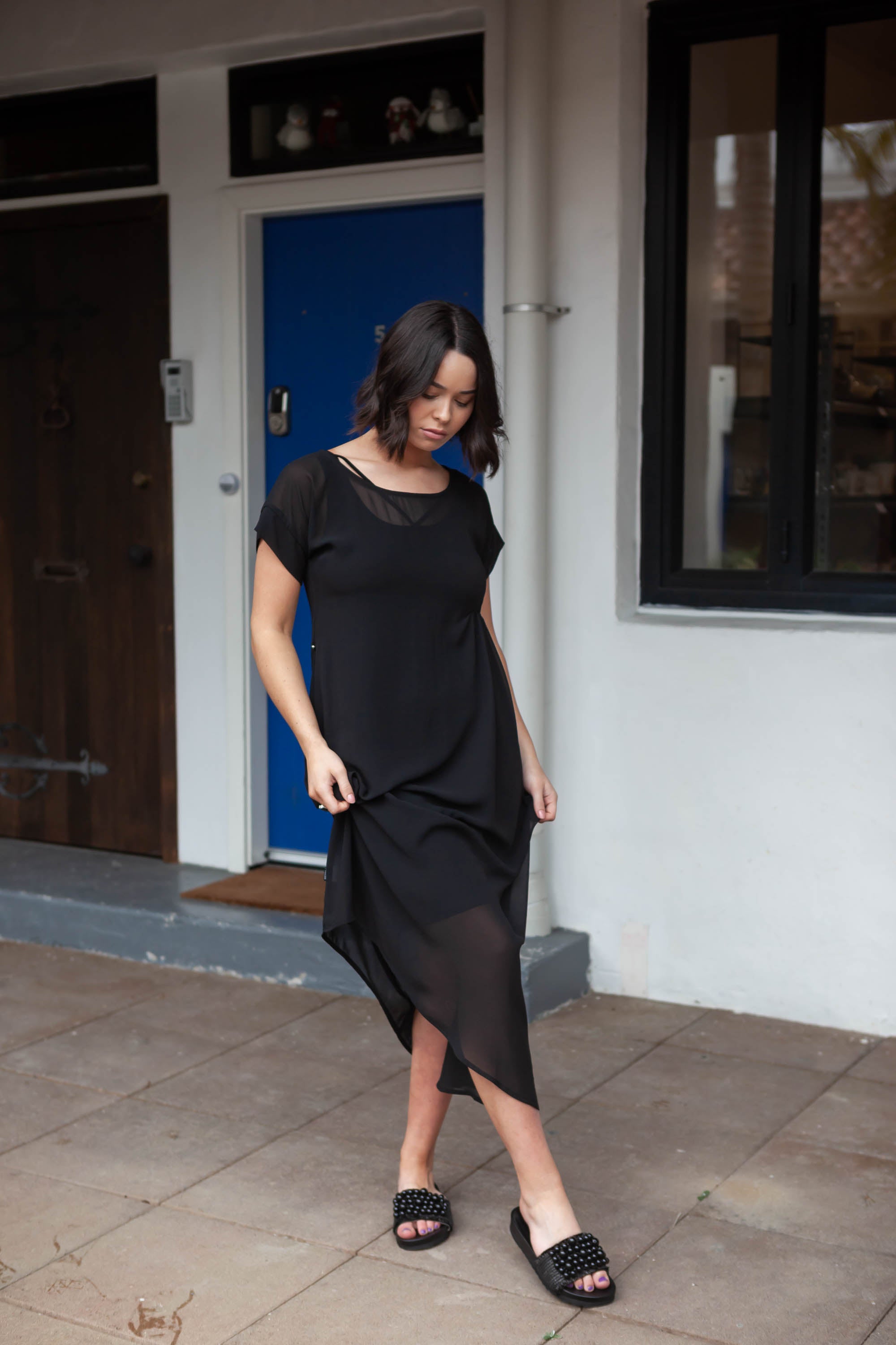 The NES Flow Dress is a multi-seasonal, versatile style that seamlessly transitions from casual to formal occasions. This dress offers a variety of styling options—wear it draped down across the front for a relaxed look, or cinch it up at the side using the adjustable side button and hem loopers for a more structured appearance. The perfect balance of comfort and elegance, this dress can be styled with our Lattice Slip