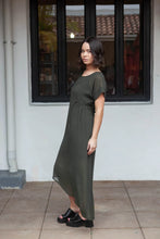 Load image into Gallery viewer, The NES Flow Dress is a multi-seasonal, versatile style that seamlessly transitions from casual to formal occasions. This dress offers a variety of styling options—wear it draped down across the front for a relaxed look, or cinch it up at the side using the adjustable side button and hem loopers for a more structured appearance. The perfect balance of comfort and elegance, this dress can be styled with our Lattice Slip
