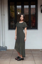 The NES Flow Dress is a multi-seasonal, versatile style that seamlessly transitions from casual to formal occasions. This dress offers a variety of styling options—wear it draped down across the front for a relaxed look, or cinch it up at the side using the adjustable side button and hem loopers for a more structured appearance. The perfect balance of comfort and elegance, this dress can be styled with our Lattice Slip