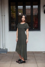 Load image into Gallery viewer, The NES Flow Dress is a multi-seasonal, versatile style that seamlessly transitions from casual to formal occasions. This dress offers a variety of styling options—wear it draped down across the front for a relaxed look, or cinch it up at the side using the adjustable side button and hem loopers for a more structured appearance. The perfect balance of comfort and elegance, this dress can be styled with our Lattice Slip
