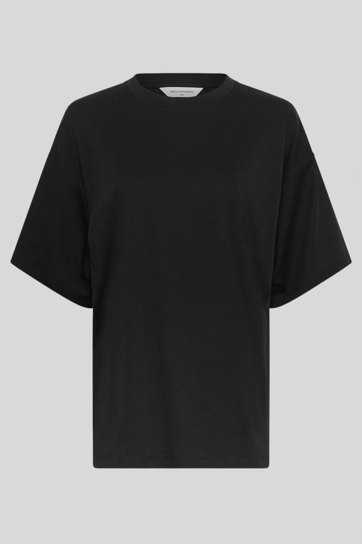 MSCH Kinsey Melea Tee in black by MSCH Copenhagen. Oversized organic cotton T-shirt with a round neckline, dropped shoulders and short sleeves for a relaxed boxy fit. Soft everyday staple in 100% organic cotton.