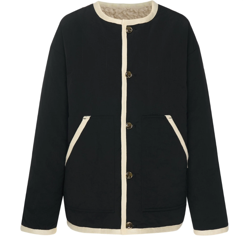 Juniper by Moke women’s reversible winter jacket with two distinct looks. One side features a clean silhouette with contrast piping for a refined everyday finish, while the reverse reveals plush faux shearling with soft pile texture for added warmth and a cosy statement feel. Designed for effortless layering, this thicker winter essential offers a relaxed yet polished fit, versatile styling, and is thoughtfully designed in New Zealand.