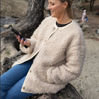 Juniper by Moke women’s reversible winter jacket with two distinct looks. One side features a clean silhouette with contrast piping for a refined everyday finish, while the reverse reveals plush faux shearling with soft pile texture for added warmth and a cosy statement feel. Designed for effortless layering, this thicker winter essential offers a relaxed yet polished fit, versatile styling, and is thoughtfully designed in New Zealand.