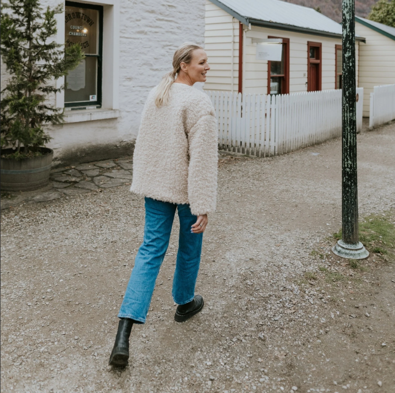 Juniper by Moke women’s reversible winter jacket with two distinct looks. One side features a clean silhouette with contrast piping for a refined everyday finish, while the reverse reveals plush faux shearling with soft pile texture for added warmth and a cosy statement feel. Designed for effortless layering, this thicker winter essential offers a relaxed yet polished fit, versatile styling, and is thoughtfully designed in New Zealand.