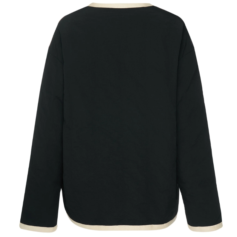 Juniper by Moke women’s reversible winter jacket with two distinct looks. One side features a clean silhouette with contrast piping for a refined everyday finish, while the reverse reveals plush faux shearling with soft pile texture for added warmth and a cosy statement feel. Designed for effortless layering, this thicker winter essential offers a relaxed yet polished fit, versatile styling, and is thoughtfully designed in New Zealand.