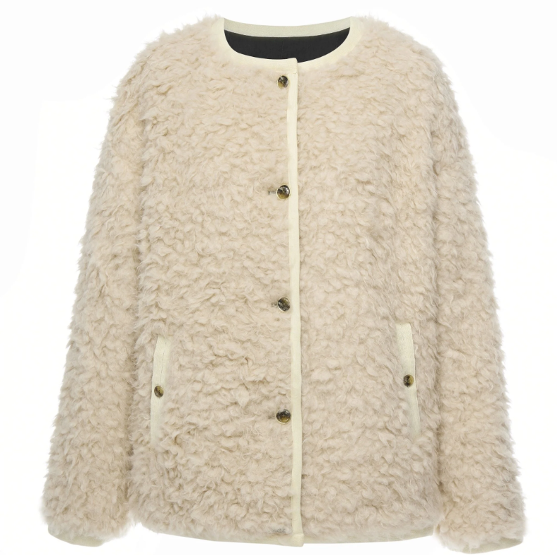 Juniper by Moke women’s reversible winter jacket with two distinct looks. One side features a clean silhouette with contrast piping for a refined everyday finish, while the reverse reveals plush faux shearling with soft pile texture for added warmth and a cosy statement feel. Designed for effortless layering, this thicker winter essential offers a relaxed yet polished fit, versatile styling, and is thoughtfully designed in New Zealand.