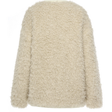 Juniper by Moke women’s reversible winter jacket with two distinct looks. One side features a clean silhouette with contrast piping for a refined everyday finish, while the reverse reveals plush faux shearling with soft pile texture for added warmth and a cosy statement feel. Designed for effortless layering, this thicker winter essential offers a relaxed yet polished fit, versatile styling, and is thoughtfully designed in New Zealand.