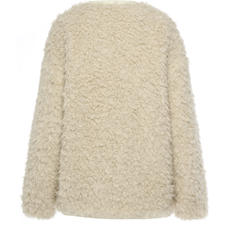 Juniper by Moke women’s reversible winter jacket with two distinct looks. One side features a clean silhouette with contrast piping for a refined everyday finish, while the reverse reveals plush faux shearling with soft pile texture for added warmth and a cosy statement feel. Designed for effortless layering, this thicker winter essential offers a relaxed yet polished fit, versatile styling, and is thoughtfully designed in New Zealand.