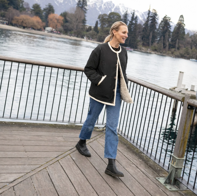 Juniper by Moke women’s reversible winter jacket with two distinct looks. One side features a clean silhouette with contrast piping for a refined everyday finish, while the reverse reveals plush faux shearling with soft pile texture for added warmth and a cosy statement feel. Designed for effortless layering, this thicker winter essential offers a relaxed yet polished fit, versatile styling, and is thoughtfully designed in New Zealand.