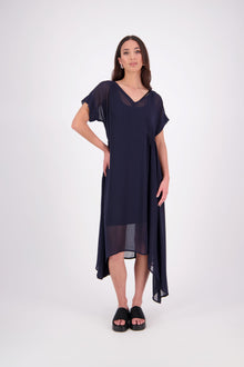 The NES Kira Dress blends the best of two favourites – the elegance of the Dreamliner and the versatility of the Flow Dress. With a relaxed drape and subtle tailoring, it features a flattering V-neckline, rouching under the bust on one side, cap sleeves, and adjustable button loop detailing for styling versatility (one dress - wear it 3 ways).
