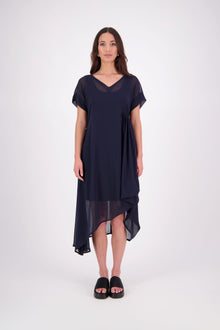The NES Kira Dress blends the best of two favourites – the elegance of the Dreamliner and the versatility of the Flow Dress. With a relaxed drape and subtle tailoring, it features a flattering V-neckline, rouching under the bust on one side, cap sleeves, and adjustable button loop detailing for styling versatility (one dress - wear it 3 ways).