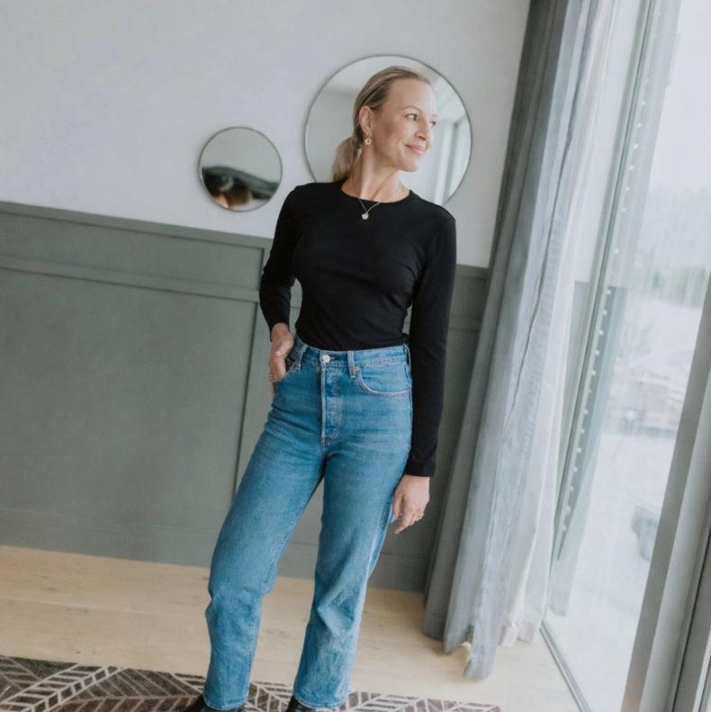 Lina by Moke women’s ribbed jersey top in a buttery soft double layered fabric for warmth, comfort, and confident coverage. Designed with a smooth, body skimming fit, round neckline, and long sleeves for effortless layering. Finished with subtle pale gold hardware at the back neck for a refined touch. An elevated everyday essential designed in New Zealand for polished, easy wear.