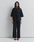 ROMY | JUNE SHIRT

Oversized short sleeve shirt with concealed placket and exaggerated sleeves. Finished with delicate floral embroidery for a subtle romantic touch.

Model is a size AU8 and wears a size S

Composition: 70% Cotton, 30% Silk