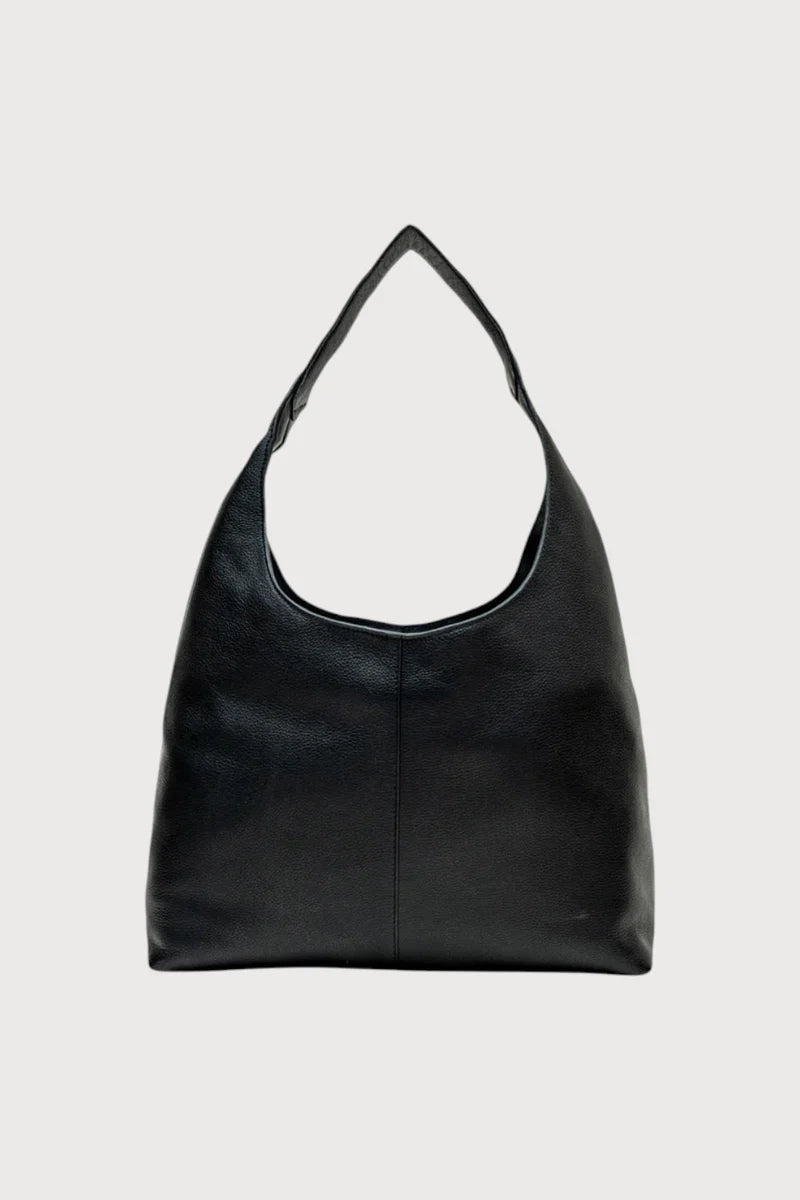 Alēo | LOLA &nbsp;SHOULDER BAG
Large hobo style shoulder bag featuring a spacious interior.
Internal compartments and comfortable wide shoulder strap.
Internal foil embossed signature.
Calf suede leather.

Dimensions
Height: 50 cm
Width: 35.5 cm
Depth: 13 cm

Designed in Ireland.