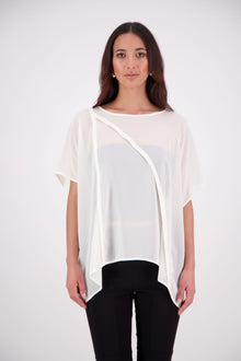  The N-E-S Luna Top – A New Take on Sheer Simplicity
The Luna Top is a modern evolution of a NES favourite. Crafted with exposed French seams on the outside, an angled front seam, and a left-side split for added movement, this sheer layer brings elevated ease to any outfit. Style it over a NES lattice singlet or your favourite base – the Luna Top is designed for effortless layering with a refined edge.
polyester chiffon
designed & made in NZ