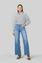 Marrie Jeans in Colour Rodeo Blue.
 Mid rise, straightens in the knee and widens in the leg. Composition: Stretch Denim - 99% Cotton 1% Elastane.BRAND: DRICOPER