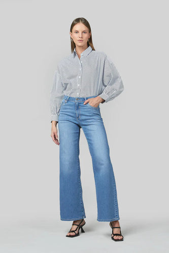 Marrie Jeans in Colour Rodeo Blue.
 Mid rise, straightens in the knee and widens in the leg. Composition: Stretch Denim - 99% Cotton 1% Elastane.BRAND: DRICOPER