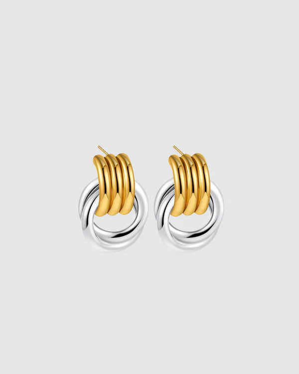 Elegant with a sculptural twist, the Castel & Co Millie Earrings in radiant gold and silver feature an interwoven, knotted form that embodies modern minimalism.

Material: Stainless steel, Gold plating &amp; silver plating
Closure Type: Stud
Earring Size: 2 x 1.3 cm
Waterproof and hypoallergenic
Weight: 6g