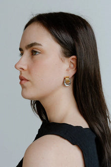 Elegant with a sculptural twist, the Castel & Co Millie Earrings in radiant gold and silver feature an interwoven, knotted form that embodies modern minimalism.

Material: Stainless steel, Gold plating &amp; silver plating
Closure Type: Stud
Earring Size: 2 x 1.3 cm
Waterproof and hypoallergenic
Weight: 6g