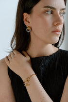 Elegant with a sculptural twist, the Castel & Co Millie Earrings in radiant gold and silver feature an interwoven, knotted form that embodies modern minimalism.

Material: Stainless steel, Gold plating &amp; silver plating
Closure Type: Stud
Earring Size: 2 x 1.3 cm
Waterproof and hypoallergenic
Weight: 6g