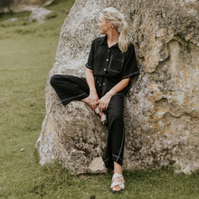 MISSY SHIRT BY MOKE
Step into effortless summer style with this beautifully crafted shirt, designed for both comfort and sophistication. Made from a luxurious blend of viscose, Tencel, rayon, and linen, this floaty, breathable piece offers the perfect balance of lightness and structure. The classic shirt collar and soft curved hemline lend it a timeless appeal, while the pale gold branded Moke buttons add a subtle touch of elegance.