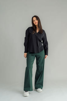 The NES Billie Shirt  long sleeves and a stretchy shirt fabric. Small metal shank buttons on the cuff and elastic loopers. cotton rayon stretch