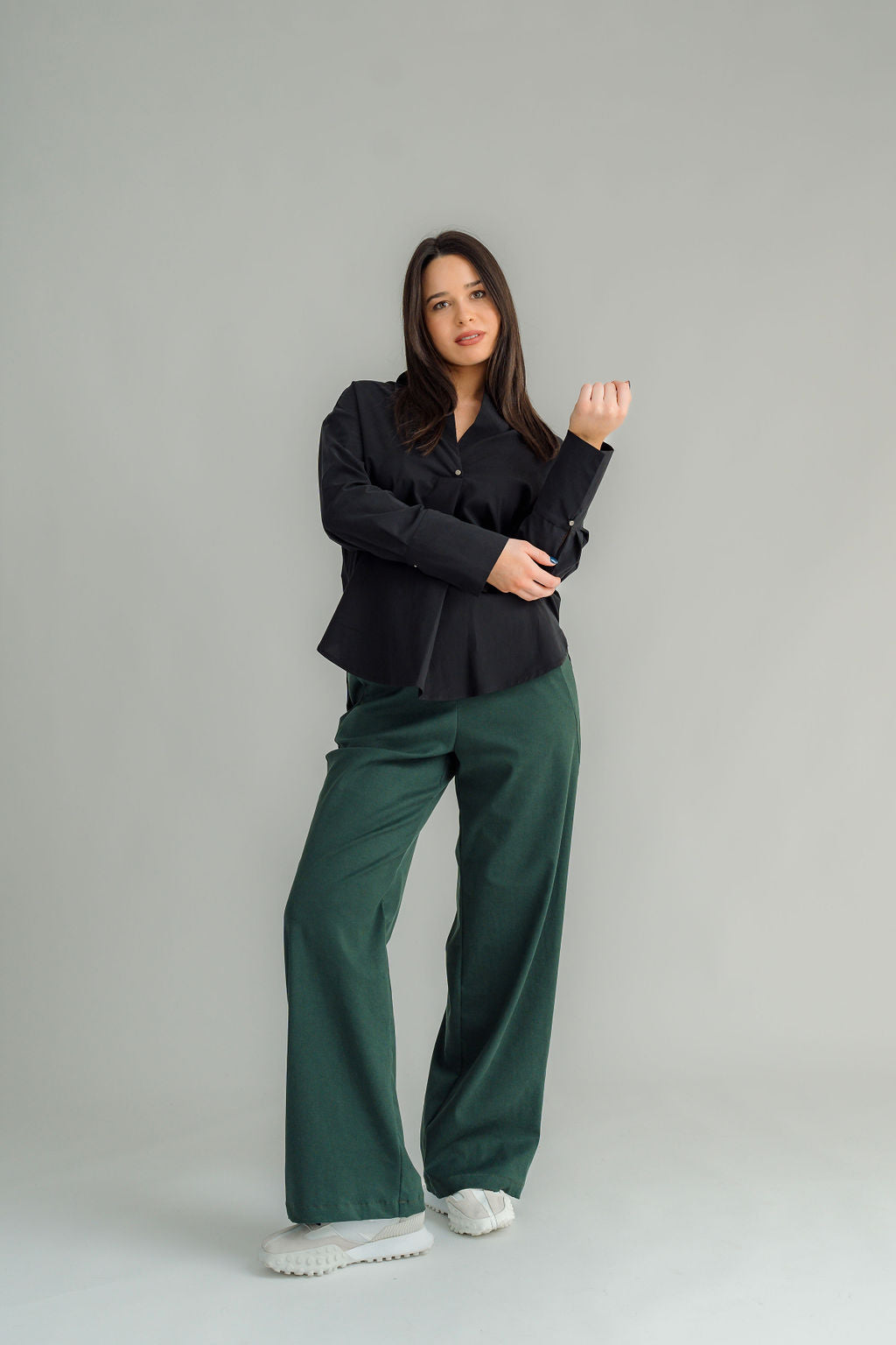 The NES Billie Shirt  long sleeves and a stretchy shirt fabric. Small metal shank buttons on the cuff and elastic loopers. cotton rayon stretch