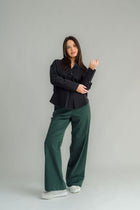 The NES Billie Shirt  long sleeves and a stretchy shirt fabric. Small metal shank buttons on the cuff and elastic loopers. cotton rayon stretch