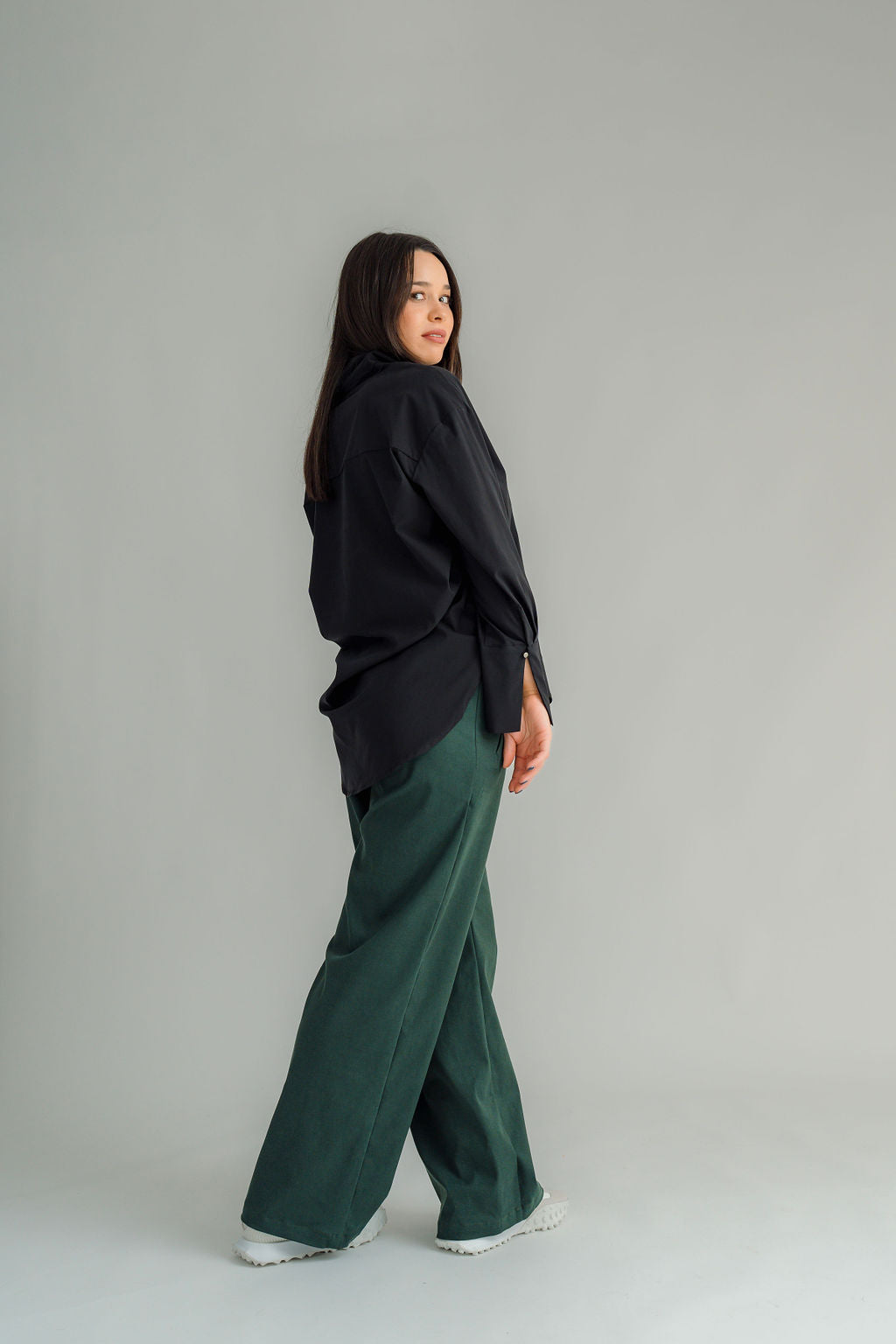 The NES Billie Shirt  long sleeves and a stretchy shirt fabric. Small metal shank buttons on the cuff and elastic loopers. cotton rayon stretch