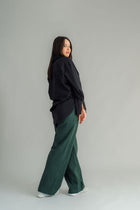 The NES Billie Shirt  long sleeves and a stretchy shirt fabric. Small metal shank buttons on the cuff and elastic loopers. cotton rayon stretch