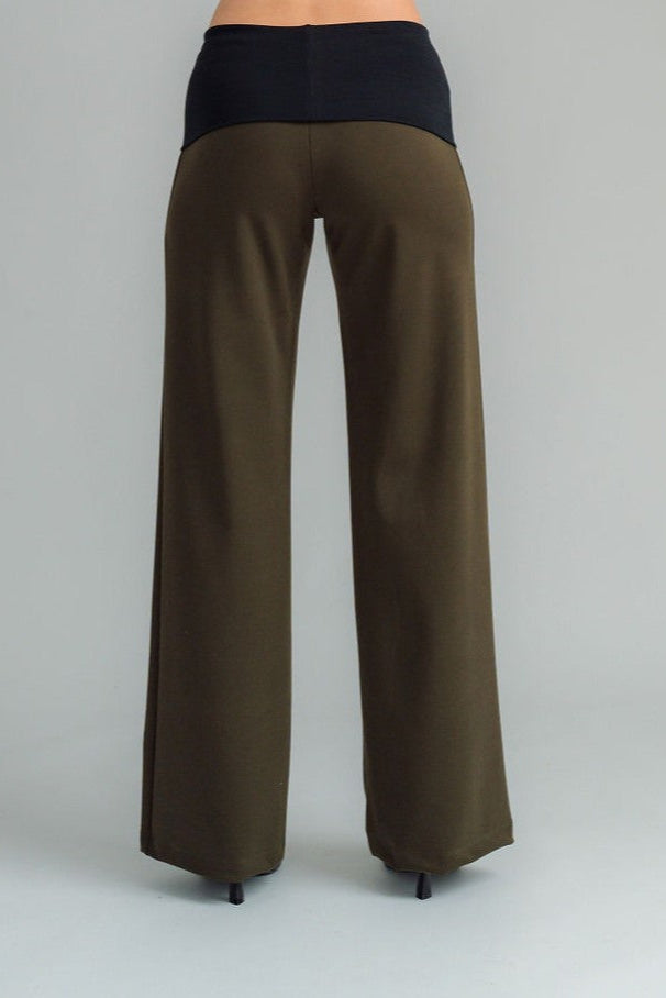 the Famous NES Dolly Bird Pants are back and better than ever! These wide-leg pants feature a versatile fold-down waistband that can be worn up or folded for a customizable fit. Whether you’re dressing up or down, these pants will quickly become your go-to wardrobe staple for years to come. Available in two lengths: