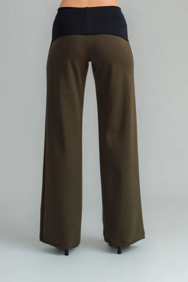 the Famous NES Dolly Bird Pants are back and better than ever! These wide-leg pants feature a versatile fold-down waistband that can be worn up or folded for a customizable fit. Whether you’re dressing up or down, these pants will quickly become your go-to wardrobe staple for years to come. Available in two lengths: