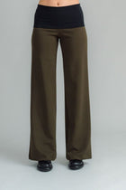 the Famous NES Dolly Bird Pants are back and better than ever! These wide-leg pants feature a versatile fold-down waistband that can be worn up or folded for a customizable fit. Whether you’re dressing up or down, these pants will quickly become your go-to wardrobe staple for years to come. Available in two lengths: