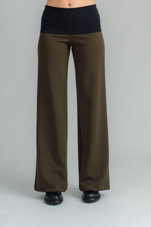 the Famous NES Dolly Bird Pants are back and better than ever! These wide-leg pants feature a versatile fold-down waistband that can be worn up or folded for a customizable fit. Whether you’re dressing up or down, these pants will quickly become your go-to wardrobe staple for years to come. Available in two lengths:
