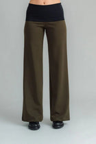 the Famous NES Dolly Bird Pants are back and better than ever! These wide-leg pants feature a versatile fold-down waistband that can be worn up or folded for a customizable fit. Whether you’re dressing up or down, these pants will quickly become your go-to wardrobe staple for years to come. Available in two lengths: