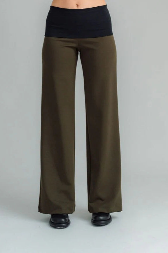 the Famous NES Dolly Bird Pants are back and better than ever! These wide-leg pants feature a versatile fold-down waistband that can be worn up or folded for a customizable fit. Whether you’re dressing up or down, these pants will quickly become your go-to wardrobe staple for years to come. Available in two lengths: