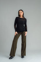 the Famous NES Dolly Bird Pants are back and better than ever! These wide-leg pants feature a versatile fold-down waistband that can be worn up or folded for a customizable fit. Whether you’re dressing up or down, these pants will quickly become your go-to wardrobe staple for years to come. Available in two lengths: Ponte Viscose poly spandex
