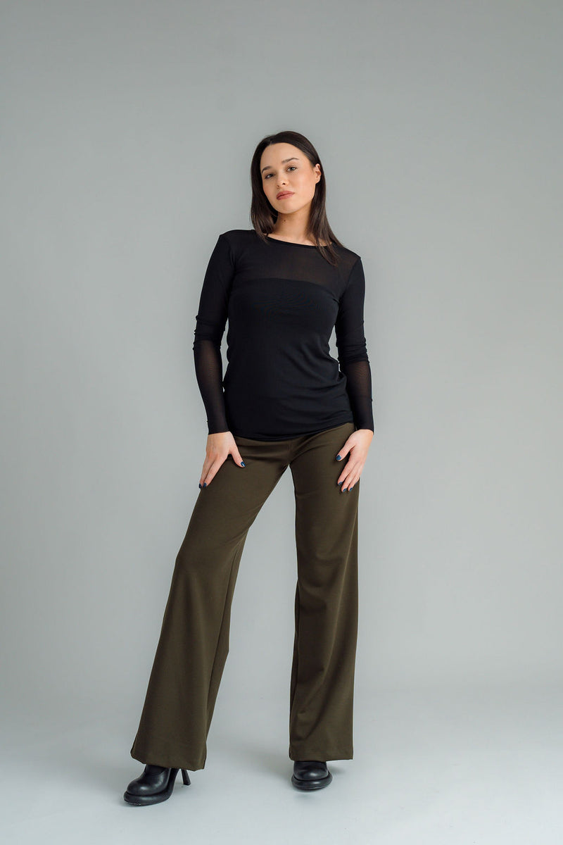 the Famous NES Dolly Bird Pants are back and better than ever! These wide-leg pants feature a versatile fold-down waistband that can be worn up or folded for a customizable fit. Whether you’re dressing up or down, these pants will quickly become your go-to wardrobe staple for years to come. Available in two lengths: Ponte Viscose poly spandex